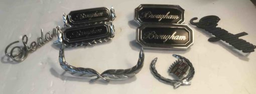 Cadillac Brougham script emblems